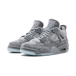 Close-up view of the Nike Air Jordan 4 Retro Kaws sneakers featuring a unique grey suede upper, signature Kaws artwork, and iconic Air Jordan branding, perfect for sneaker collectors and streetwear enthusiasts.