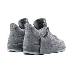 High-quality replica sneakers featuring the Nike Air Jordan 4 Retro Kaws, showcasing a sleek design with a stylish grey upper, unique fabric textures, and iconic Jordan branding, perfect for sneaker enthusiasts.