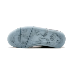 High-quality replica sneakers featuring the Nike Air Jordan 4 Retro Kaws design, showcasing a sleek gray upper, unique textured detailing, and signature Kaws branding on the tongue, perfect for sneaker enthusiasts looking for stylish shoes.