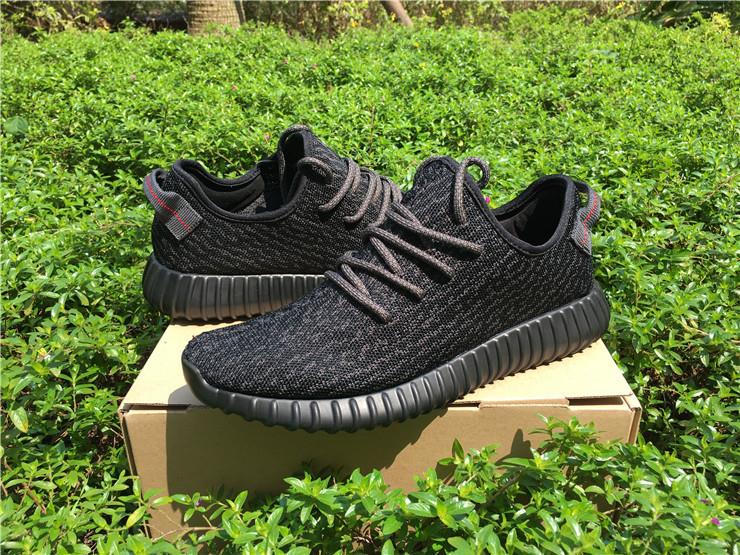 Adidas Yeezy 350 Boost Pirate Black replica sneakers featuring a sleek black primeknit upper, signature branding, and a comfortable Boost sole designed for style and performance.