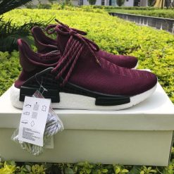 Adidas Human Race NMD Wine Red replica sneakers featuring a bold wine red upper, distinct lacing system, and signature branding for a stylish, high-quality look.