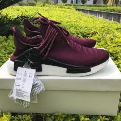 Adidas Human Race NMD Wine Red replica sneakers featuring a vibrant red upper, signature branding, and a comfortable, stylish design perfect for enthusiasts of high-quality sneaker replicas.