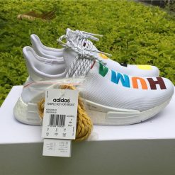 Adidas NMD Human Race White replica sneakers featuring a sleek design with prominent branding and a comfortable fit, perfect for sneaker enthusiasts and collectors.