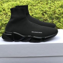 Balenciaga Speed Trainer Black replica sneakers showcasing a sleek design with a knitted upper and contrasting white sole, ideal for fashion-forward sneaker enthusiasts.