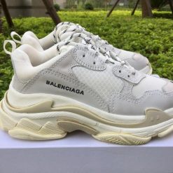 Balenciaga Triple S Creamy White replica sneakers featuring a stylish and modern design with a neutral color palette, showcasing high-quality materials and detailed craftsmanship, perfect for sneaker enthusiasts and fashion lovers.