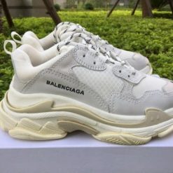 Wholesale Luxury Balenciaga Triple S Creamy White sneakers showcasing a high-quality design, featuring a blend of cream and white colors, perfect for sneaker enthusiasts seeking stylish replica sneakers.