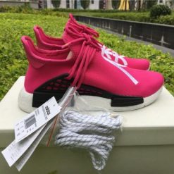 Pharrell x Adidas NMD Human Race Shock Pink replica sneakers showcasing vibrant pink design with bold text and premium craftsmanship, perfect for sneaker enthusiasts and collectors.