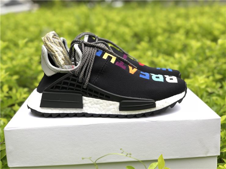 Adidas Human Race Black replica sneakers showcasing a sleek black design with bold white lettering, perfect for sneaker enthusiasts looking for high-quality alternatives.