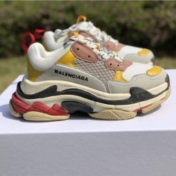 Balenciaga Triple S Yellow replica sneakers showcasing a vibrant yellow colorway with a chunky silhouette and premium detailing, ideal for streetwear enthusiasts.