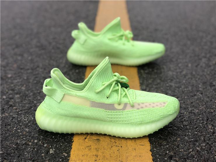 Adidas Yeezy Boost 350 V2 Glow In The Dark replica sneakers showcasing a vibrant neon green design, perfect for sneaker enthusiasts seeking high-quality alternatives.