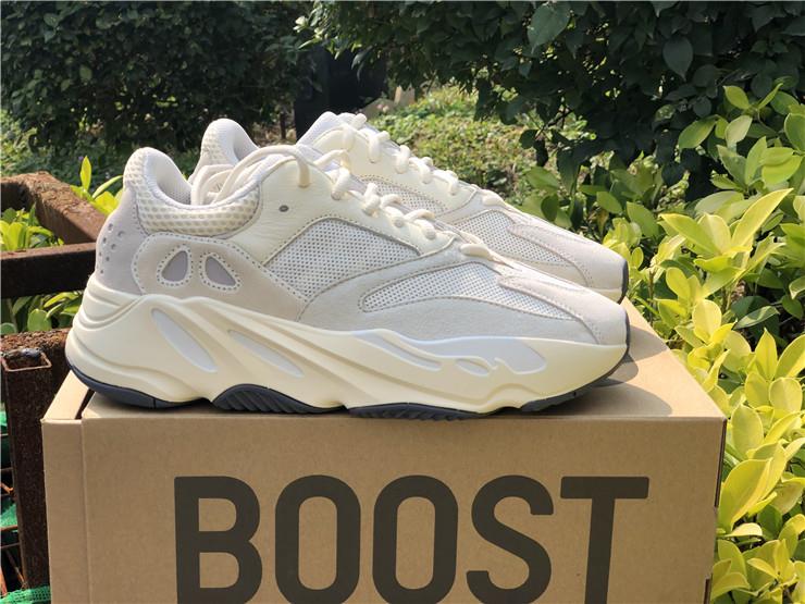 Adidas Yeezy Boost 700 Analog replica sneakers featuring a sleek, stylish design with a combination of neutral white and gray tones, perfect for sneaker enthusiasts seeking high-quality alternatives.