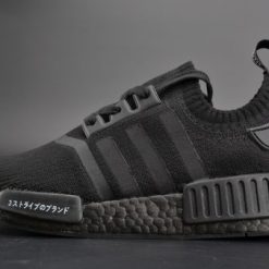 Adidas NMD R1 Primeknit Japan Triple Black replica sneakers featuring a sleek all-black design, breathable Primeknit upper, and iconic Boost cushioning for comfort and style.
