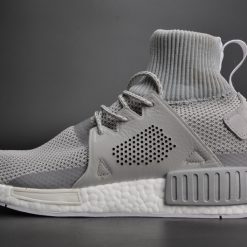 Adidas NMD XR1 Winter MID Grey Two replica sneakers featuring a stylish grey upper, mid-height design, and comfortable cushioning, perfect for both urban fashion and everyday wear.