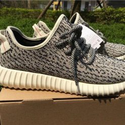 Adidas Yeezy 350 Boost Turtledove high-quality replica sneakers featuring a light grey and cream colorway with a textured primeknit upper, signature Yeezy branding, and a comfortable Boost sole for enhanced cushioning.