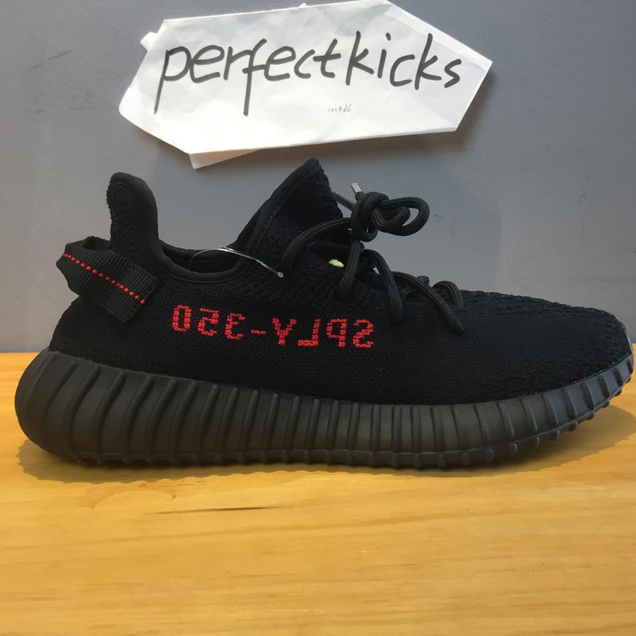 Adidas Yeezy Boost 350 V2 Black Red CP9652 replica sneakers showcasing a stylish black upper with striking red accents, perfect for sneaker enthusiasts and collectors.