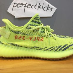 Adidas Yeezy Boost 350 V2 Semi Frozen Yellow B37572 high-quality replica sneakers showcasing a vibrant yellow design with black accents, ideal for sneaker enthusiasts seeking stylish alternatives.