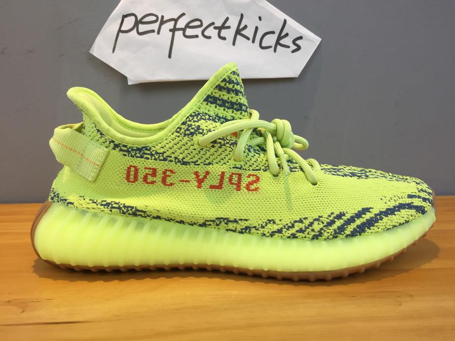 Adidas Yeezy Boost 350 V2 Semi Frozen Yellow B37572 high-quality replica sneakers showcasing a vibrant yellow design with black accents, ideal for sneaker enthusiasts seeking stylish alternatives.