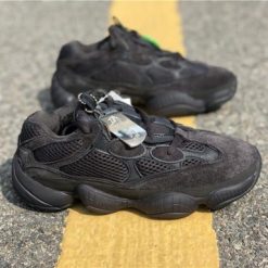 Adidas Yeezy Boost 500 Utility Black replica sneakers featuring a stylish all-black design with a mix of suede and mesh materials, perfect for casual wear and sneaker enthusiasts.