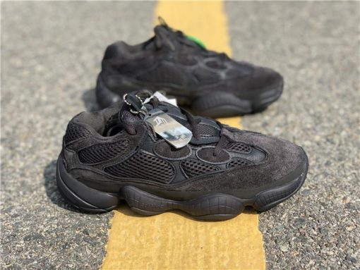 Adidas Yeezy Boost 500 Utility Black replica sneakers featuring a stylish all-black design with a mix of suede and mesh materials, perfect for casual wear and sneaker enthusiasts.