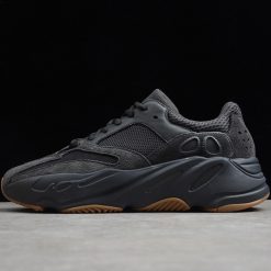 Adidas Yeezy Boost 700 Utility Black replica sneakers featuring a sleek black mesh upper with suede overlays, chunky midsole, and distinctive wave-like design, perfect for style-conscious sneaker enthusiasts.