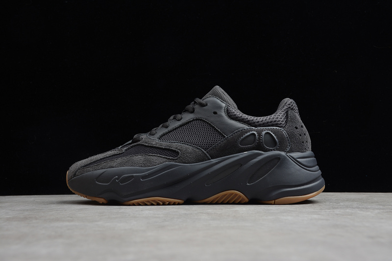 Adidas Yeezy Boost 700 Utility Black replica sneakers featuring a sleek black mesh upper with suede overlays, chunky midsole, and distinctive wave-like design, perfect for style-conscious sneaker enthusiasts.
