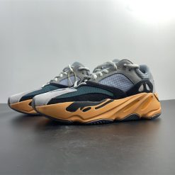 Adidas Yeezy Boost 700 Wash Orange replica sneakers showcasing a vibrant orange and neutral-toned upper, featuring a chunky sole design, perfect for sneaker enthusiasts looking for stylish and high-quality replicas.