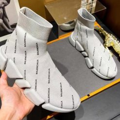 Balenciaga Speed 2.0 Allover Logo Beige Sneaker high-quality replica sneakers featuring a stylish design with a distinctive logo pattern, ideal for fashion enthusiasts looking for luxury footwear.
