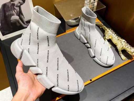 Balenciaga Speed 2.0 Allover Logo Beige Sneaker high-quality replica sneakers showcasing a stylish design with an allover logo pattern, perfect for fashion-forward individuals seeking comfort and luxury.