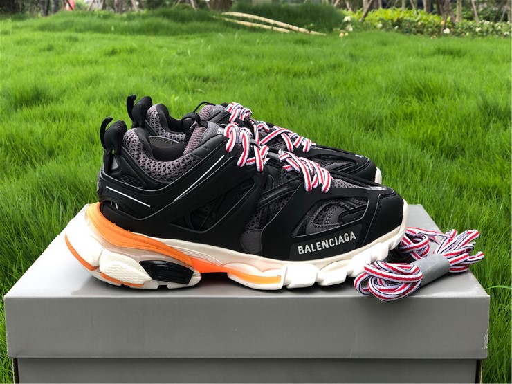 Balenciaga Track Black White Orange Sneaker replica sneakers featuring a sleek design with bold color accents, showcasing high-quality craftsmanship and stylish aesthetics.
