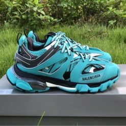 Balenciaga Track Emerald Blue Sneaker replica sneakers featuring a vibrant emerald blue colorway, intricate detailing, and a modern athletic silhouette designed for style and comfort.