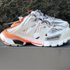 Balenciaga Track Mule White Orange Sneaker replica sneakers featuring a sleek design, vibrant color accents, and premium detailing for fashion enthusiasts seeking stylish footwear alternatives.