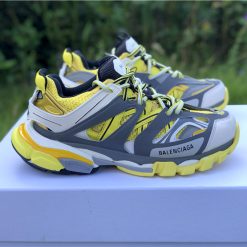Balenciaga Track Yellow Sneaker replica sneakers featuring a vibrant yellow design, layered construction, and durable materials, perfect for fashion enthusiasts seeking a stylish and comfortable footwear option.
