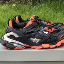 High-quality replica sneakers featuring the Balenciaga Track 2 in a striking black and orange colorway, showcasing a modern design and superior craftsmanship.