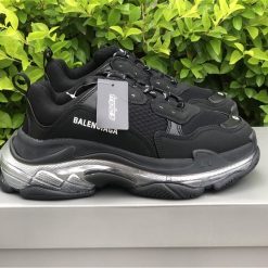 Balenciaga Triple S Clear Sole Black Silver replica sneakers featuring a sleek design and distinctive chunky silhouette, perfect for adding a touch of luxury to any outfit.