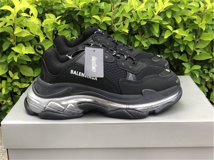Balenciaga Triple S Clear Sole Black Silver replica sneakers featuring a sleek design and distinctive chunky silhouette, perfect for adding a touch of luxury to any outfit.