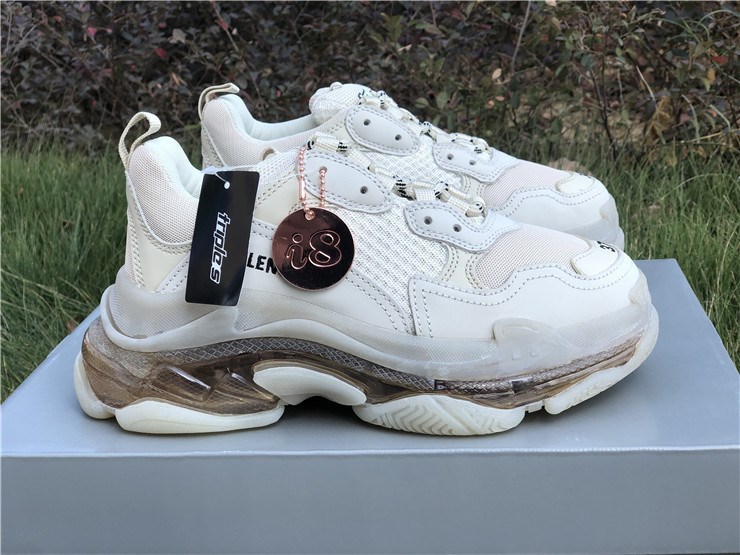 SEO Alt Text: "Balenciaga Triple S Clear Sole Off White replica sneakers showcasing a stylish design with a chunky silhouette, featuring a mix of white and off-white colors and a transparent sole, perfect for fashion-forward shoe enthusiasts."
