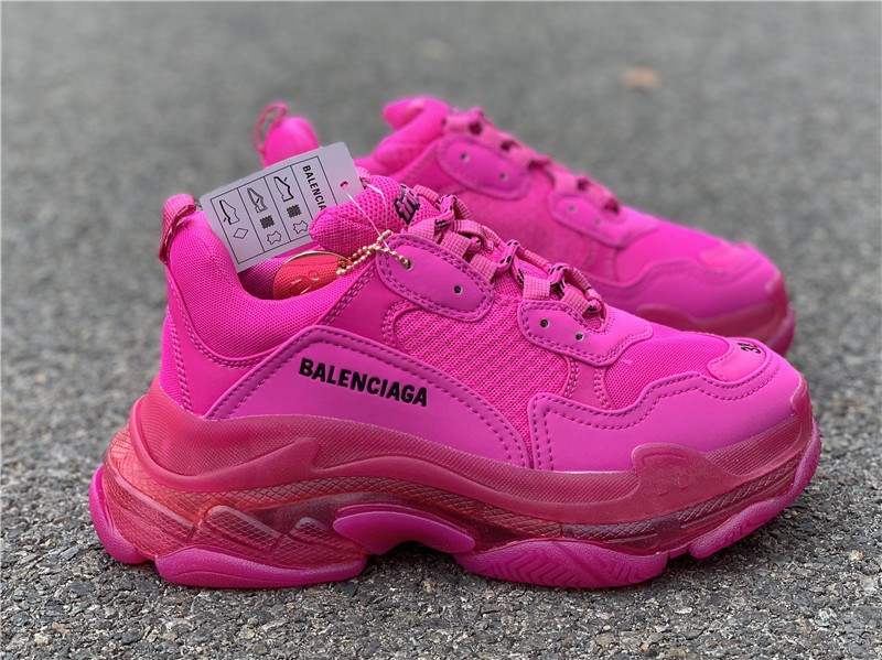 High-quality replica sneakers featuring the Balenciaga Triple S Clear Sole in a stylish pink colorway, showcasing a chunky silhouette and signature clear sole design.