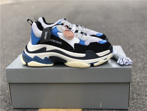 Alt Text: "Close-up view of Balenciaga Triple S White Black Blue replica sneakers featuring a stylish mix of white, black, and blue colors, showcasing the signature chunky sole and designer aesthetics perfect for sneaker enthusiasts."