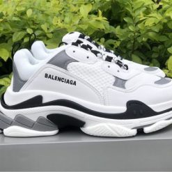 High-quality replica sneakers featuring the Balenciaga Triple S White Grey model, showcasing a stylish blend of white and grey materials with a chunky silhouette, perfect for fashion-forward enthusiasts.