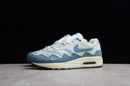 Patta x Nike Air Max 1 Waves Noise Aqua replica sneakers showcasing a vibrant color scheme with aqua and tonal wave patterns, designed for sneaker enthusiasts and collectors.