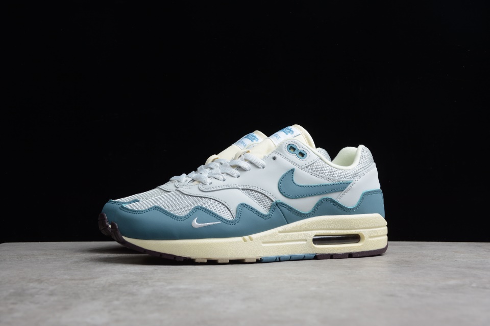 Patta x Nike Air Max 1 Waves Noise Aqua replica sneakers showcasing a vibrant color scheme with aqua accents and wave-inspired design, perfect for sneaker enthusiasts seeking high-quality replicas.