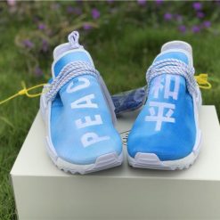 Pharrell X Adidas NMD Human Race Blue replica sneakers featuring a vibrant blue upper, signature detailing, and cushioned sole for ultimate comfort and style.