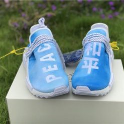 Pharrell X Adidas NMD Human Race Blue replica sneakers featuring a vibrant blue upper, striking yellow accents, and distinctive “Human Race” messaging, perfect for sneaker enthusiasts seeking high-quality replicas.