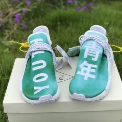 Pharrell X Adidas NMD Human Race Green replica sneakers featuring a vibrant green colorway, bold text detailing, and a stylish design perfect for sneaker enthusiasts.