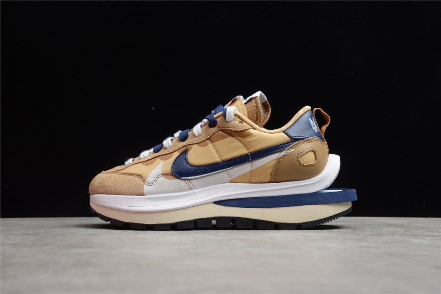 Sacai x Nike Vaporwaffle Sesame Blue Void high-quality replica sneakers showcasing a unique design with layered materials in shades of sesame and blue, featuring a mixed silhouette and a distinctive waffle sole.