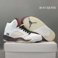 A Ma Maniére x Jordan 5 Retro OG 'Black Collective' replica sneakers featuring a sleek black premium leather upper, luxurious detailing, and signature branding for an authentic look and feel.