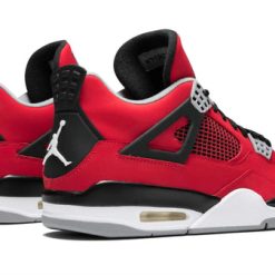 High-quality replica sneakers featuring the Jordan 4 Retro Toro Bravo Men's model, showcasing vibrant red and black colorway with iconic design elements.