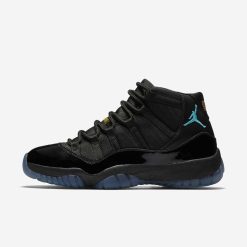 Air Jordan 11 Gamma Blue replica sneakers showcased with a sleek design featuring a black upper, icy blue outsole, and signature Jumpman logo, perfect for sneaker enthusiasts seeking high-quality replicas.