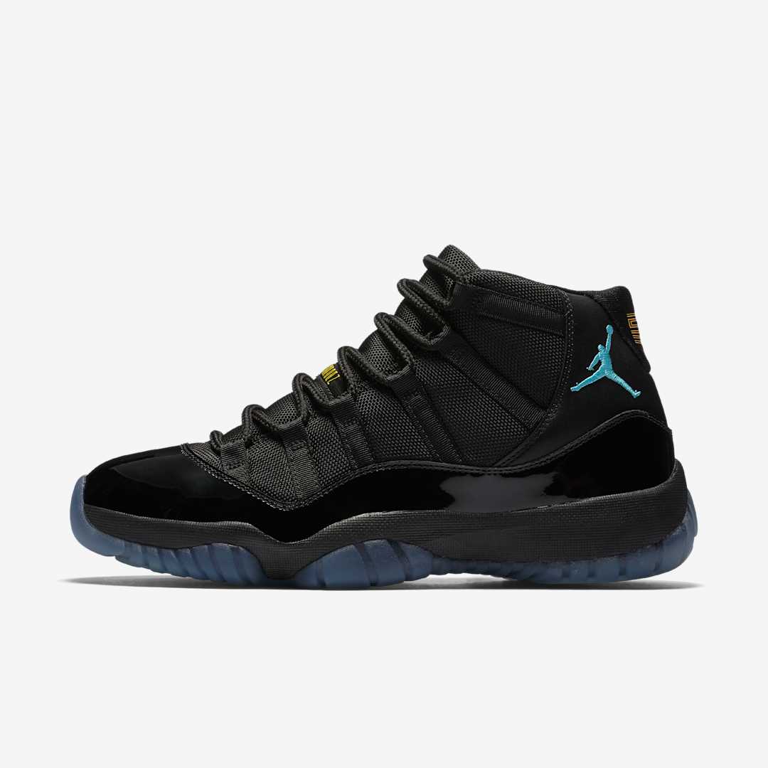 Air Jordan 11 Gamma Blue replica sneakers showcased with a sleek design featuring a black upper, icy blue outsole, and signature Jumpman logo, perfect for sneaker enthusiasts seeking high-quality replicas.