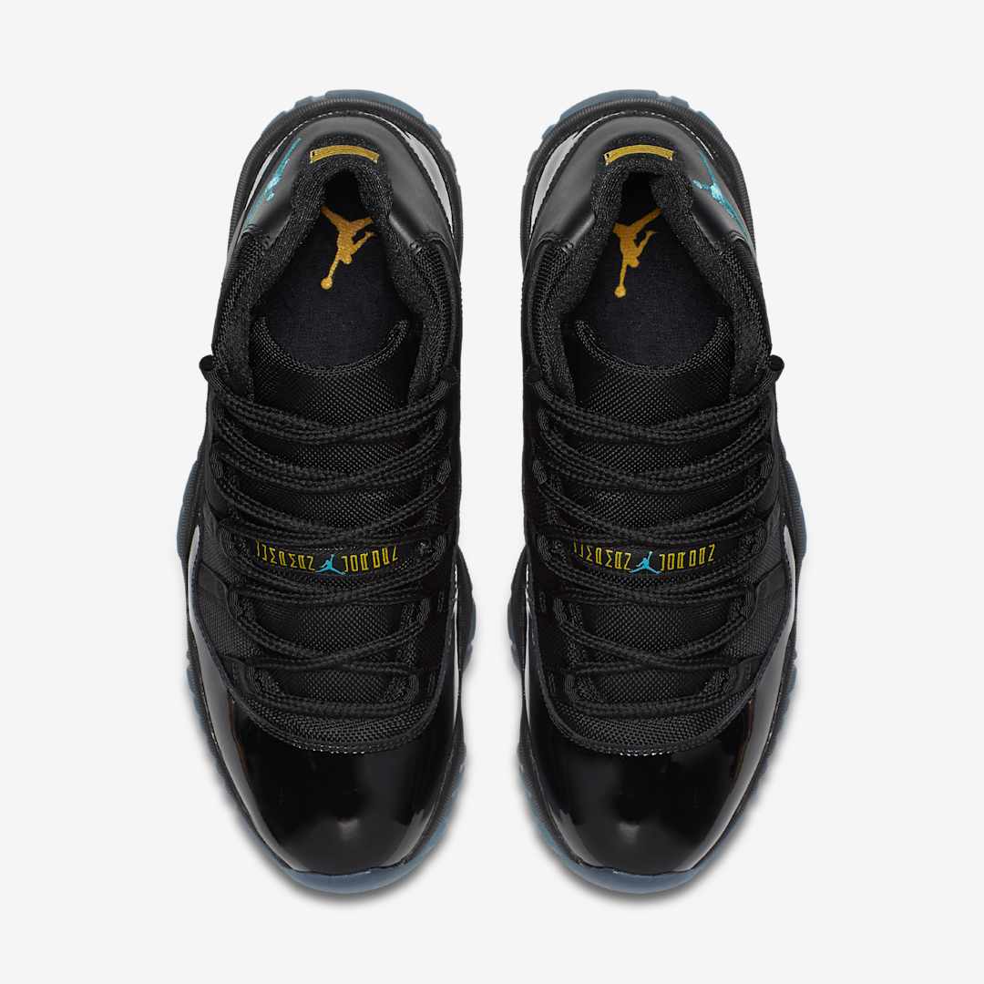 Air Jordan 11 Gamma Blue replica sneakers featuring a sleek black upper with vibrant gamma blue accents and a shiny patent leather finish, ideal for sneaker enthusiasts looking for high-quality replicas.